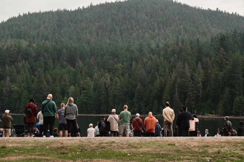 Photo of people gathered at outdoor baptism