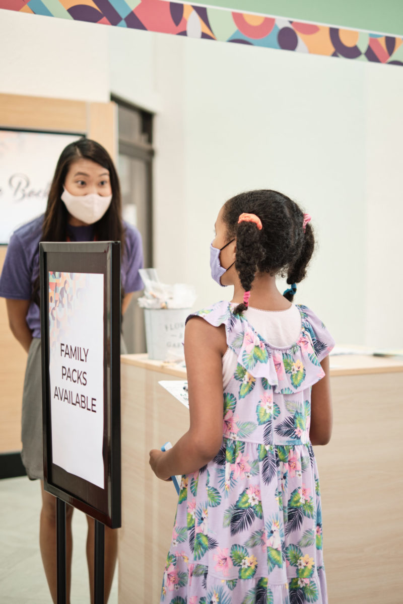 Photo of girl talking to staff