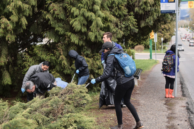 Photo of local outreach team picking up garbage